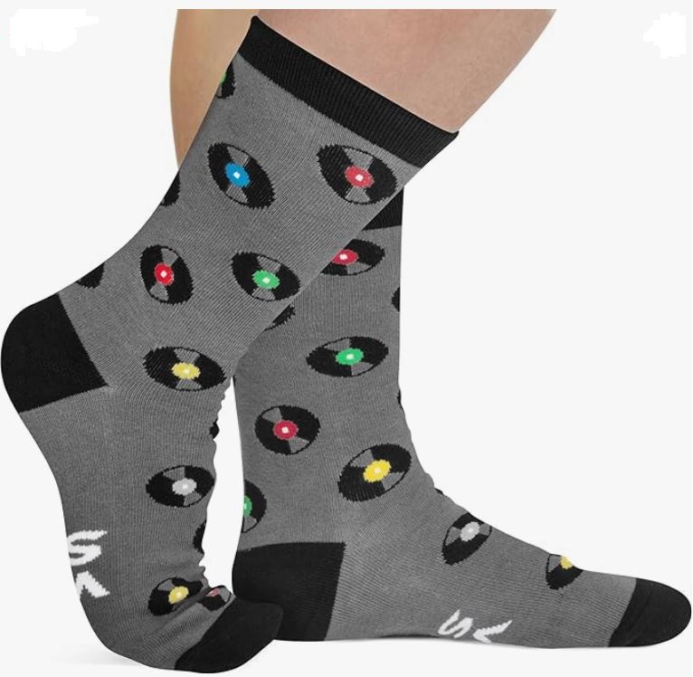 grey socks decorated with a vinyl records polka dot type motif